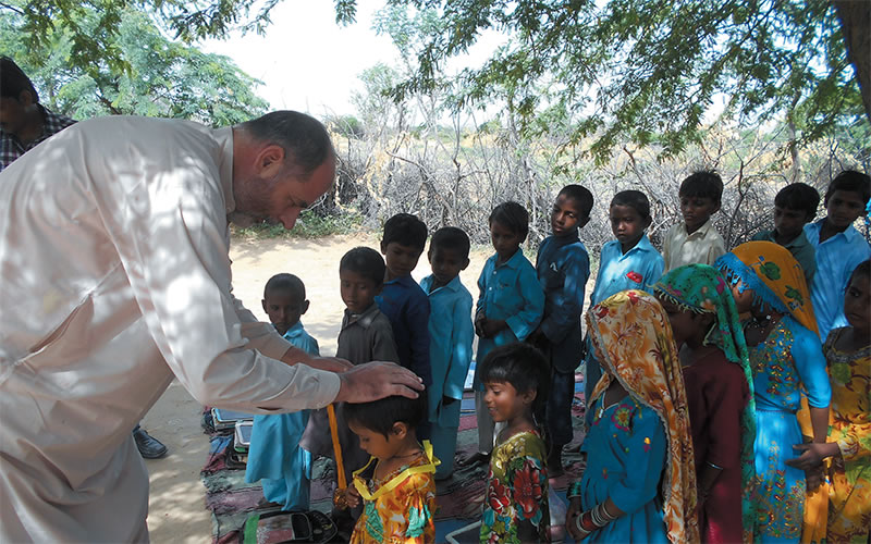Columban Fr. Tomas King blessing children